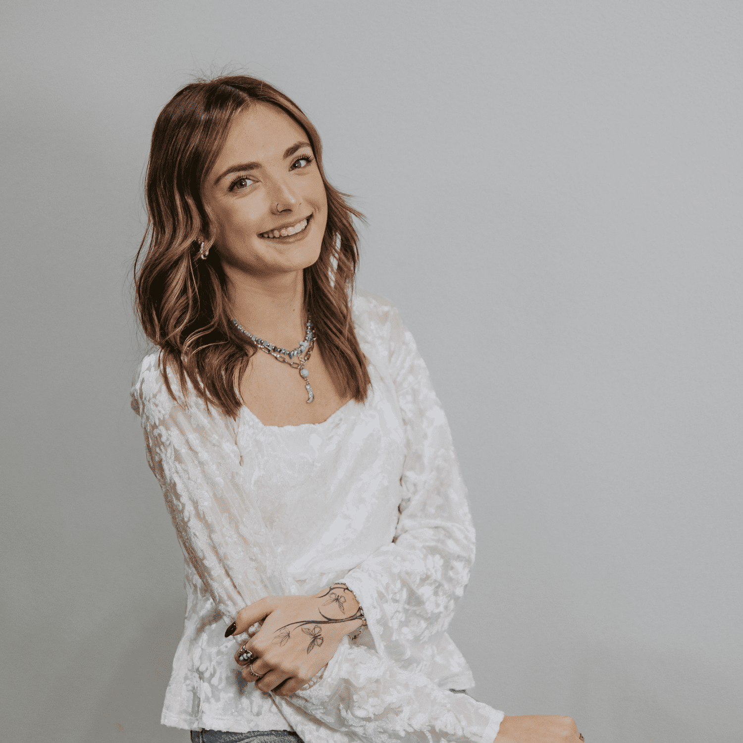 Portrait of Ashlee, a professional stylist at Craft Studio, showcasing their expertise and style.